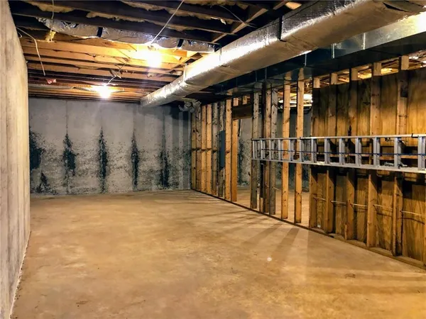 a view of a room with wooden walls