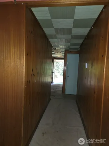 an empty room with entrance door