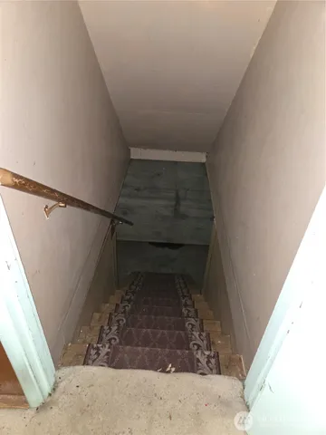 a kitchen with a stove and a refrigerator