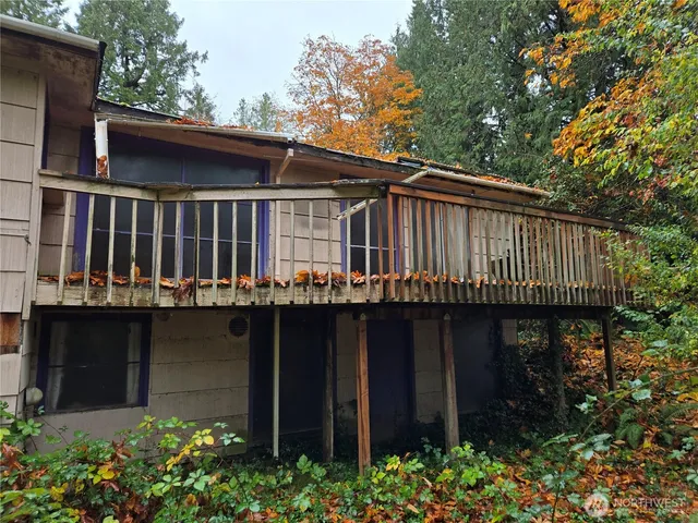 a house with lots of trees in the background