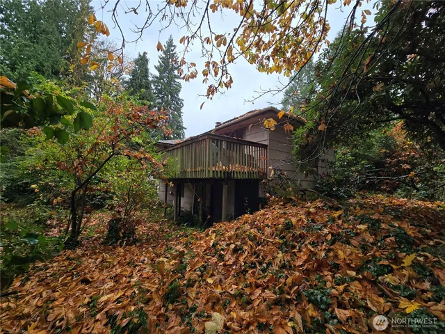 a view of a house with a tree
