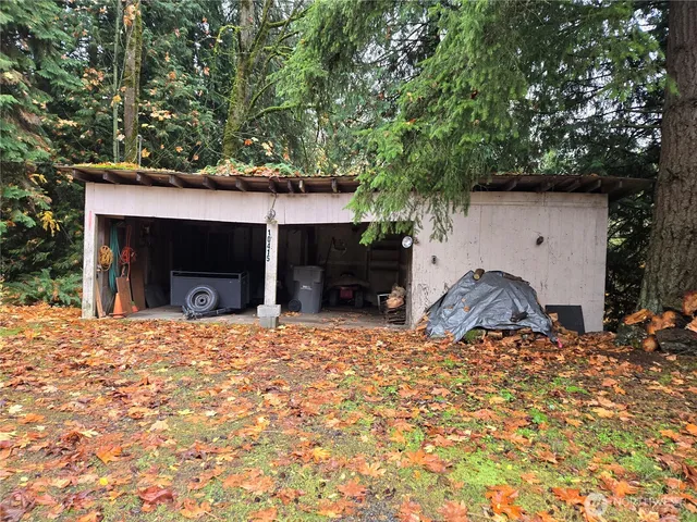 a house that has a tree in front of it