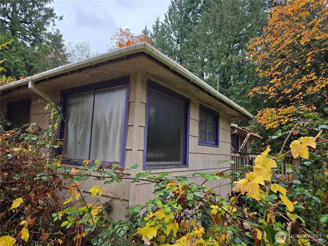 a house with trees in front of it