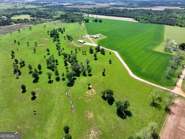 a view of a large building with a yard