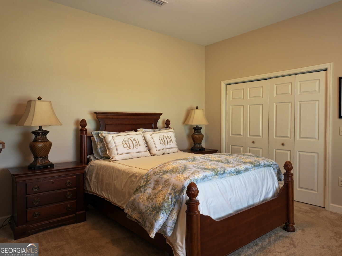 1412 Clark Road Blakely, GA 39823 - Photo 21 of 46 a bedroom with a bed and a mirror