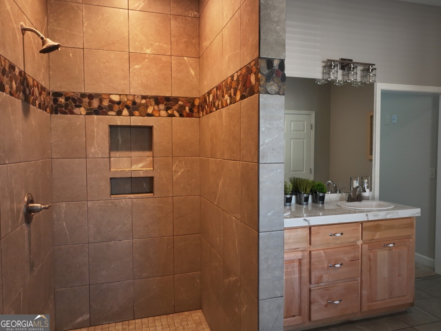1412 Clark Road Blakely, GA 39823 - Photo 24 of 46 a bathroom with a sink vanity granite and shower