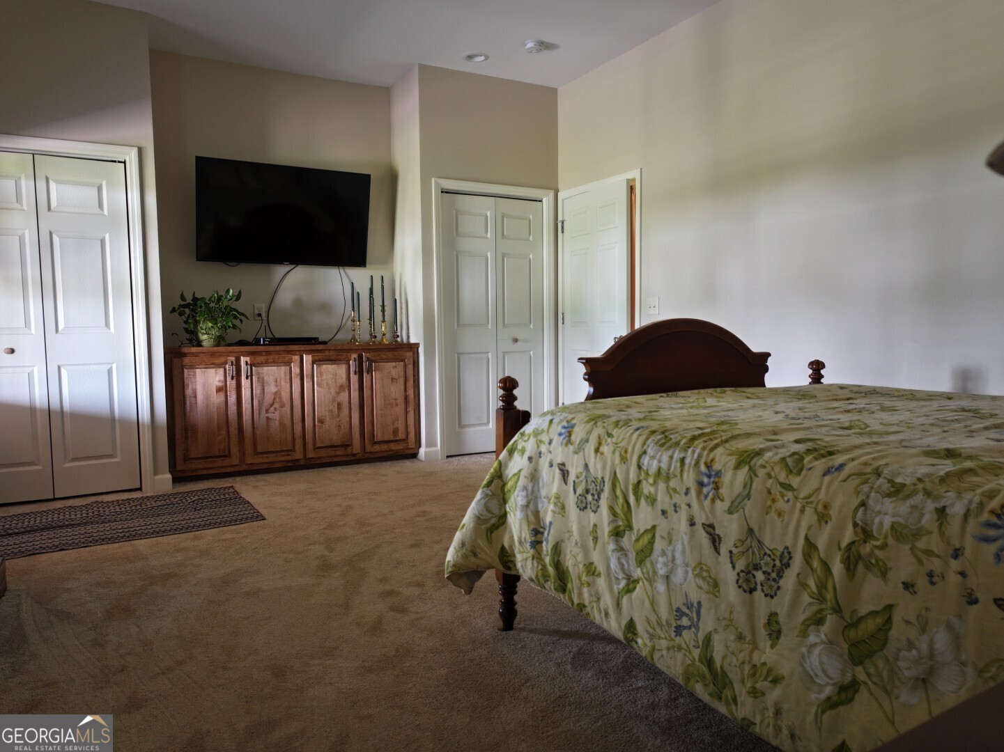 1412 Clark Road Blakely, GA 39823 - Photo 29 of 46 a bedroom with a bed and a flat screen tv