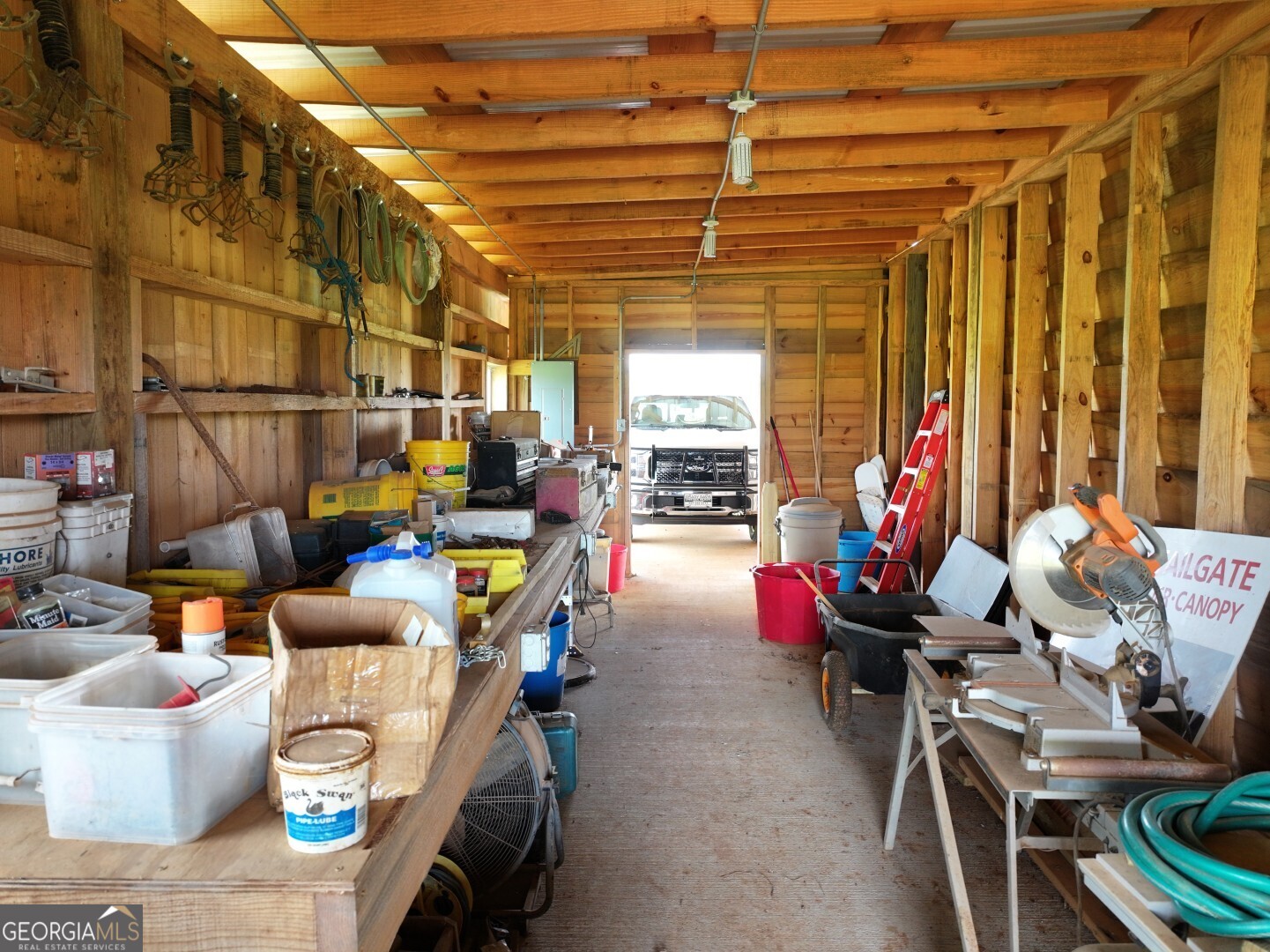 1412 Clark Road Blakely, GA 39823 - Photo 41 of 46 a living room with furniture and a chandelier