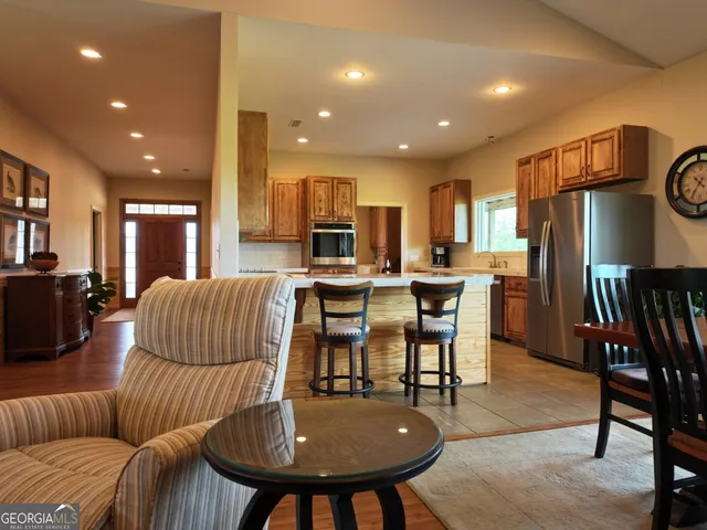 a view of a dining room with furniture and window