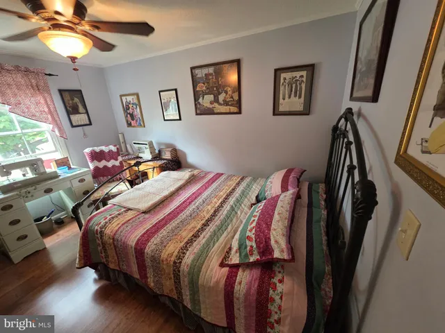 a bed room with a bed and a chandelier