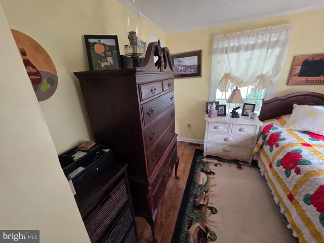 a bedroom with a bed and furniture