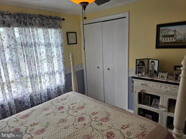 a bedroom with a bed and a fireplace