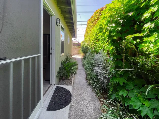 a view of a backyard with chairs and a fireplace