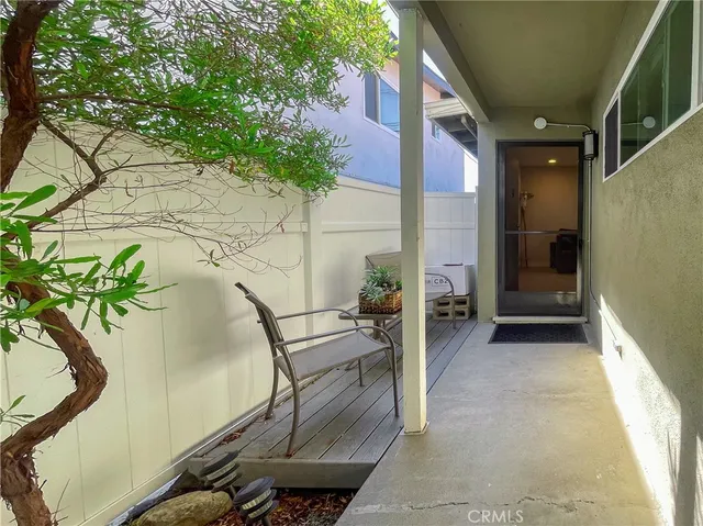 a view of balcony with furniture