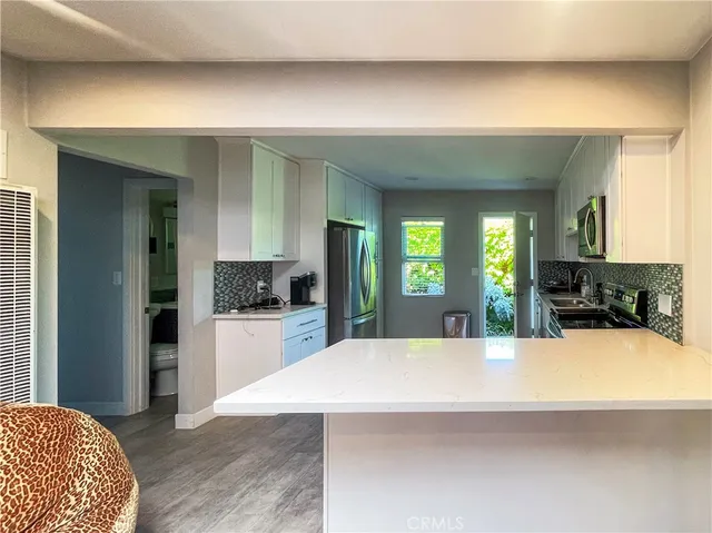a large bathroom with a sink and a large mirror