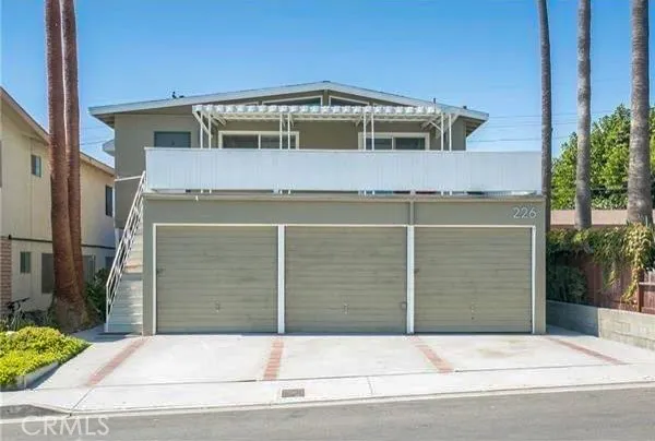 a front view of a house with a garage