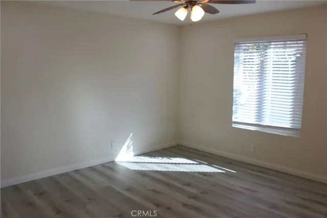 an empty room with wooden floor