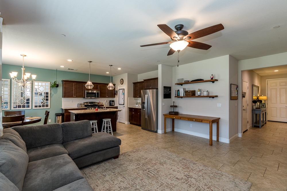 2731 Griffith Avenue Clovis, CA 93611 - Photo 14 of 34 a living room with furniture and kitchen view