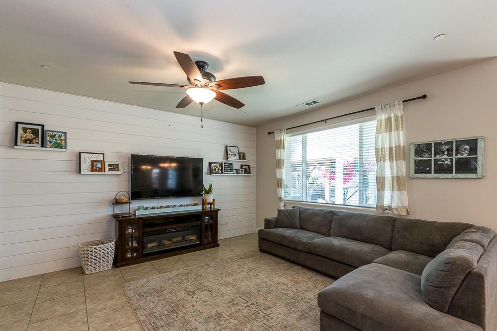2731 Griffith Avenue Clovis, CA 93611 - Photo 15 of 34 a living room with furniture and a flat screen tv