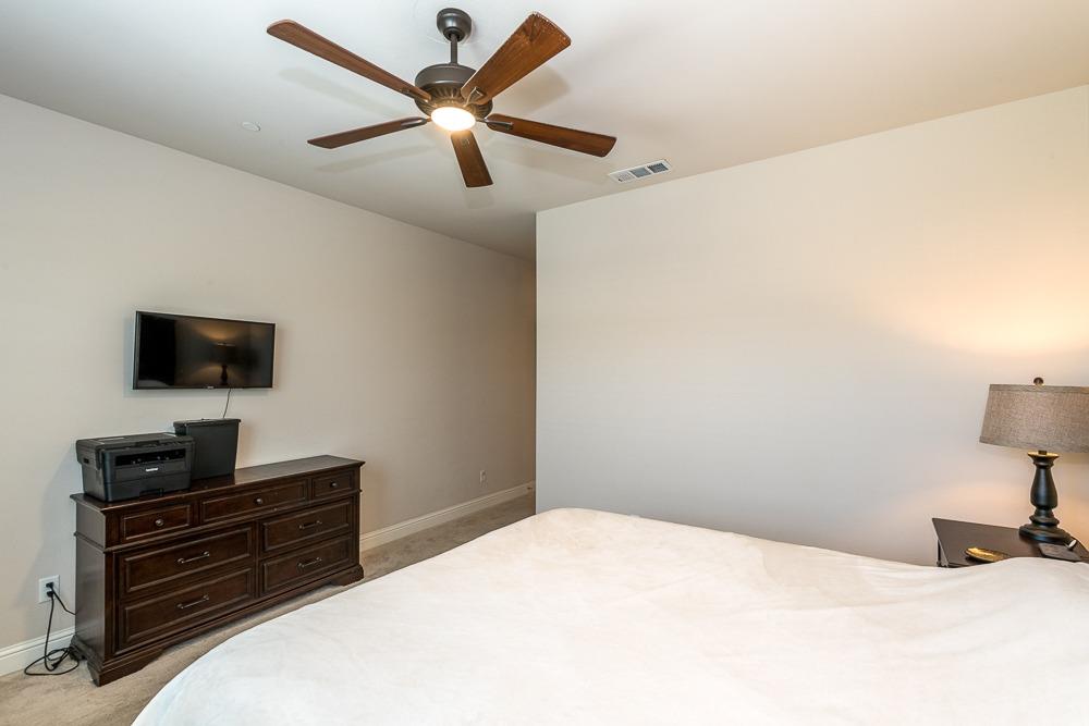 2731 Griffith Avenue Clovis, CA 93611 - Photo 27 of 34 a bedroom with a bed and a flat screen tv
