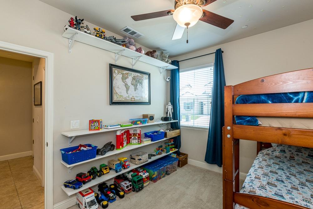 2731 Griffith Avenue Clovis, CA 93611 - Photo 30 of 34 a room with lots of baby toys and dresser