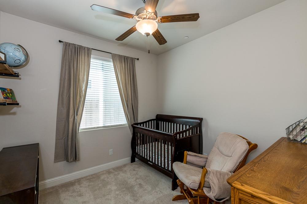 2731 Griffith Avenue Clovis, CA 93611 - Photo 32 of 34 a bedroom with a bed and a window