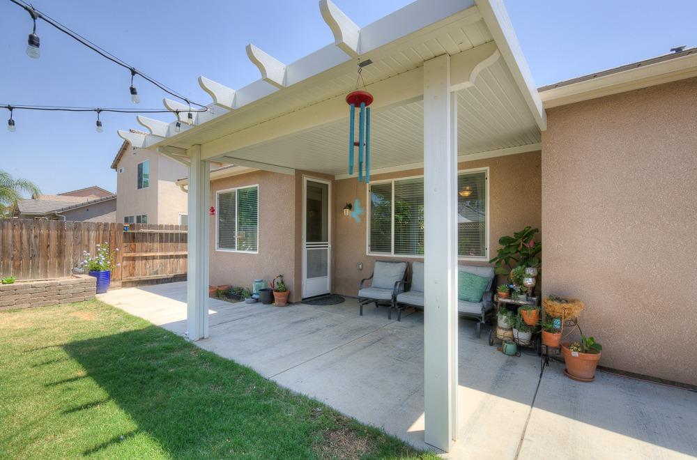 2731 Griffith Avenue Clovis, CA 93611 - Photo 6 of 34 a view of a house with backyard porch and sitting area