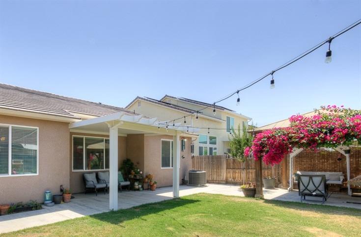 2731 Griffith Avenue Clovis, CA 93611 - Photo 7 of 34 a view of a house with backyard porch and sitting area