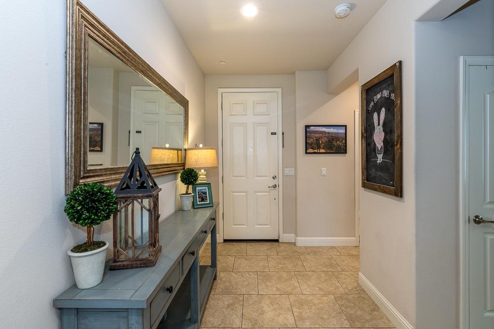 2731 Griffith Avenue Clovis, CA 93611 - Photo 10 of 34 a hallway with painting on the wall