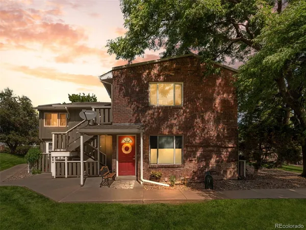 a view of a building with a yard