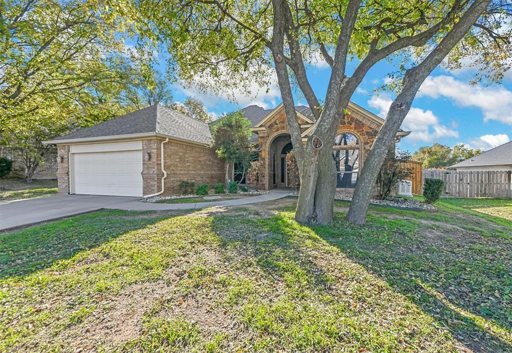 1505 West Rodden Drive Decatur, TX 76234 - Photo 1 of 1 View of front facade featuring a front yard and a garage