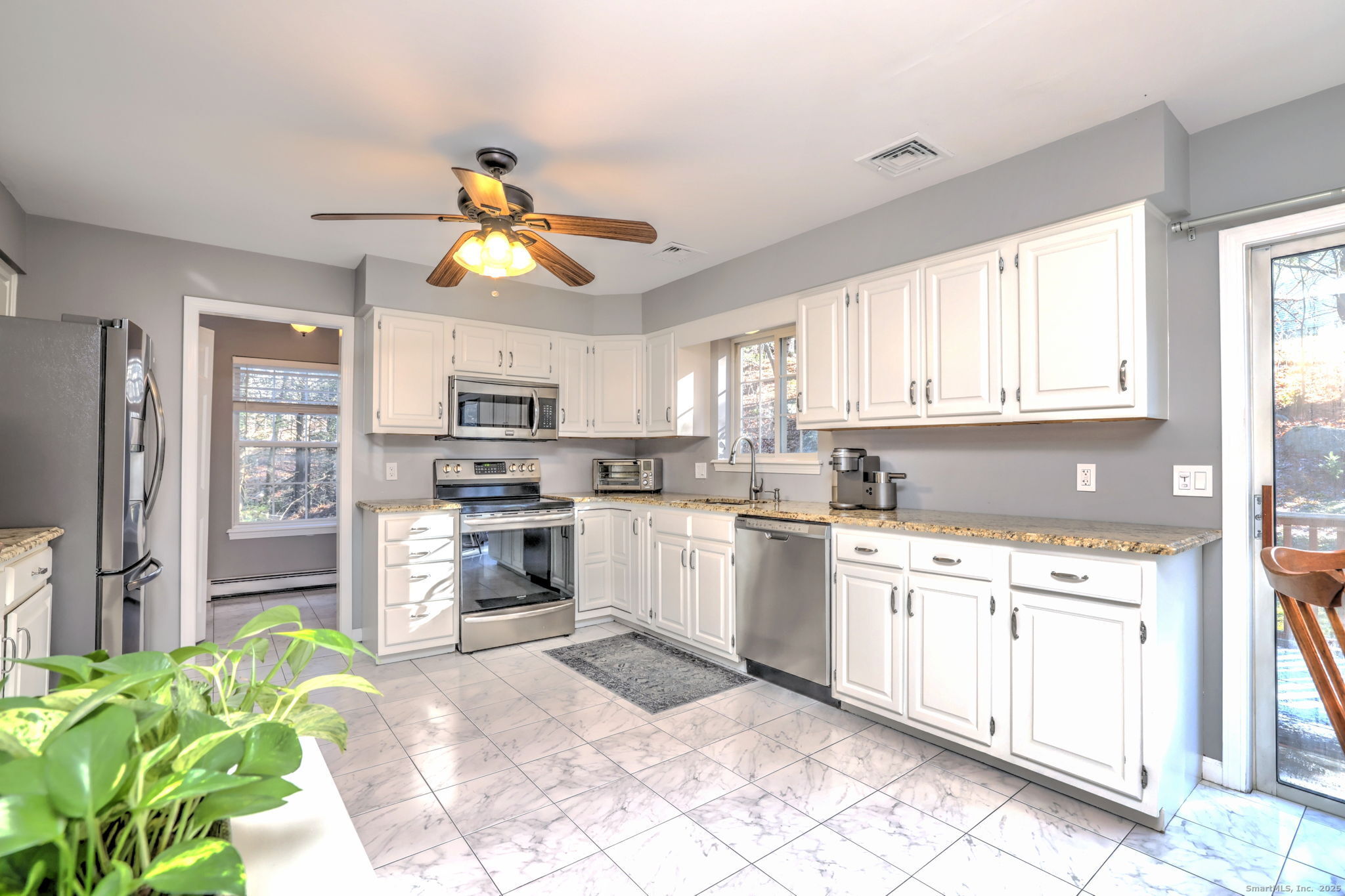 238 Turkey Roost Road Monroe, CT 06468 - Photo 12 of 34 a kitchen with a white cabinets and window