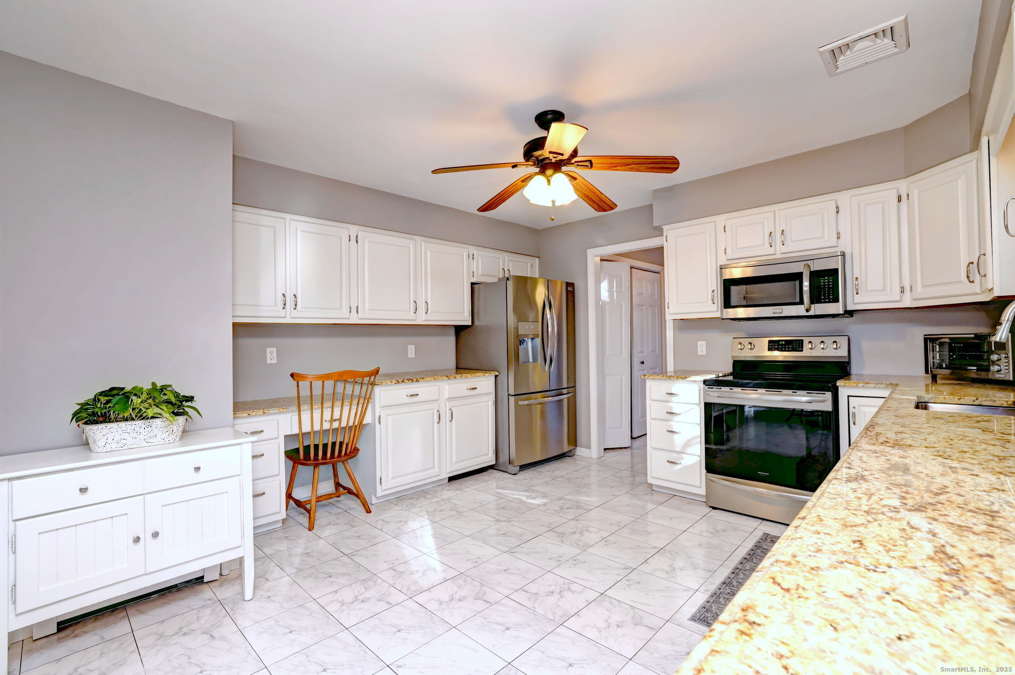 238 Turkey Roost Road Monroe, CT 06468 - Photo 13 of 34 a kitchen with stainless steel appliances kitchen island granite countertop a stove a sink and a white cabinets