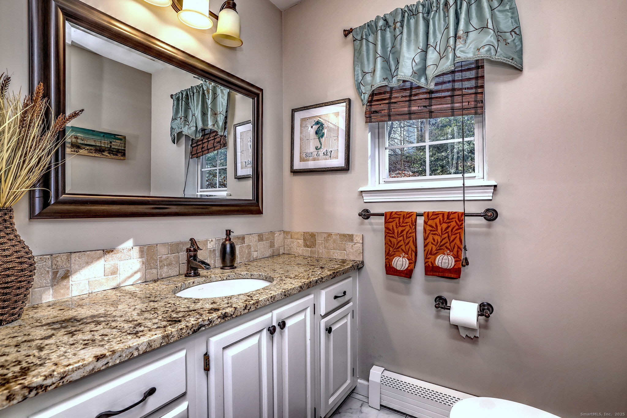 238 Turkey Roost Road Monroe, CT 06468 - Photo 17 of 34 a bathroom with a sink and a mirror