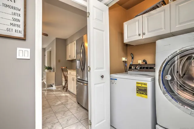 a view of living room with a washer and dryer
