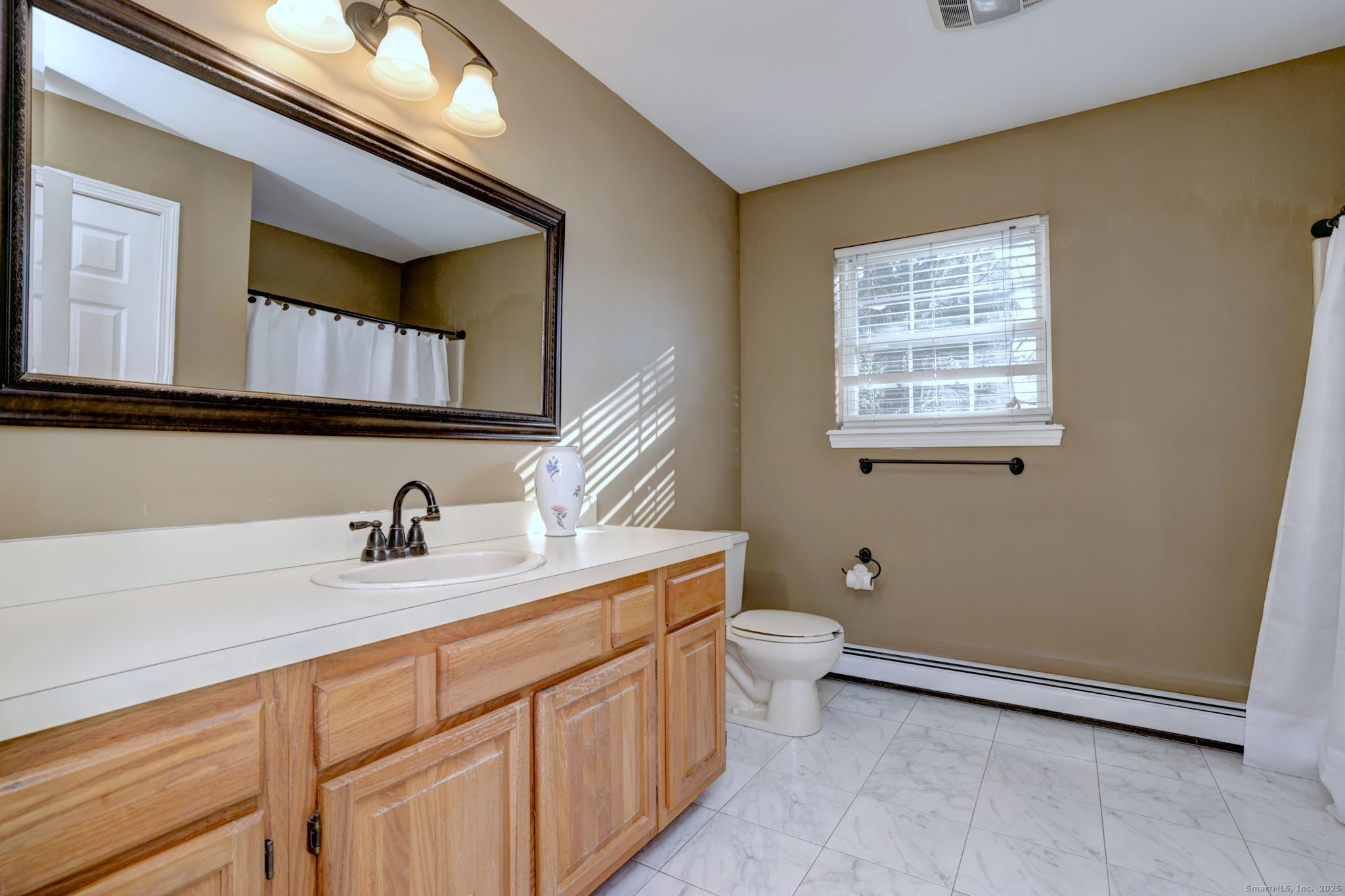 238 Turkey Roost Road Monroe, CT 06468 - Photo 21 of 34 a bathroom with a toilet sink and mirror