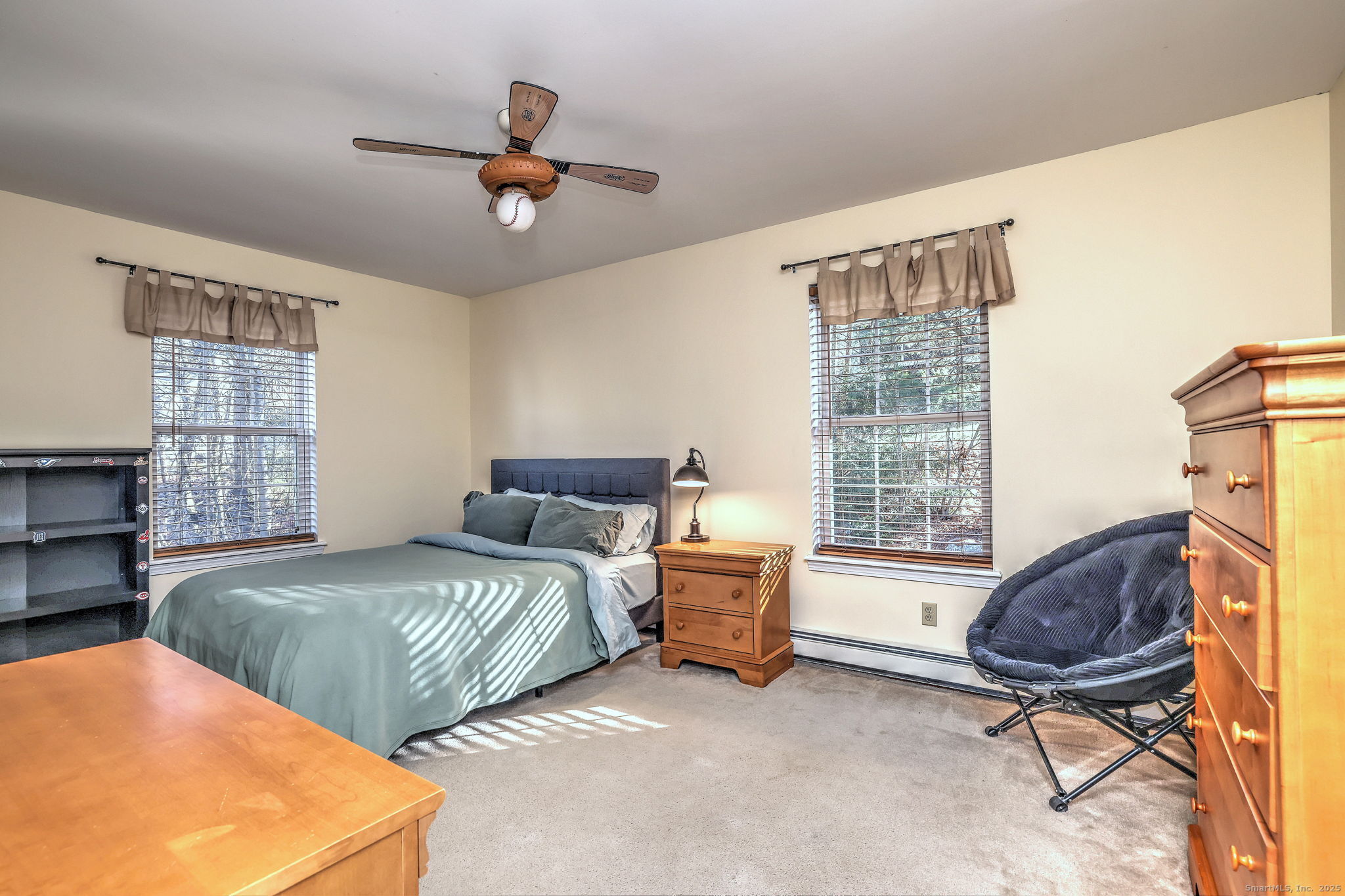 238 Turkey Roost Road Monroe, CT 06468 - Photo 24 of 34 a bedroom with a bed a chair and a chandelier