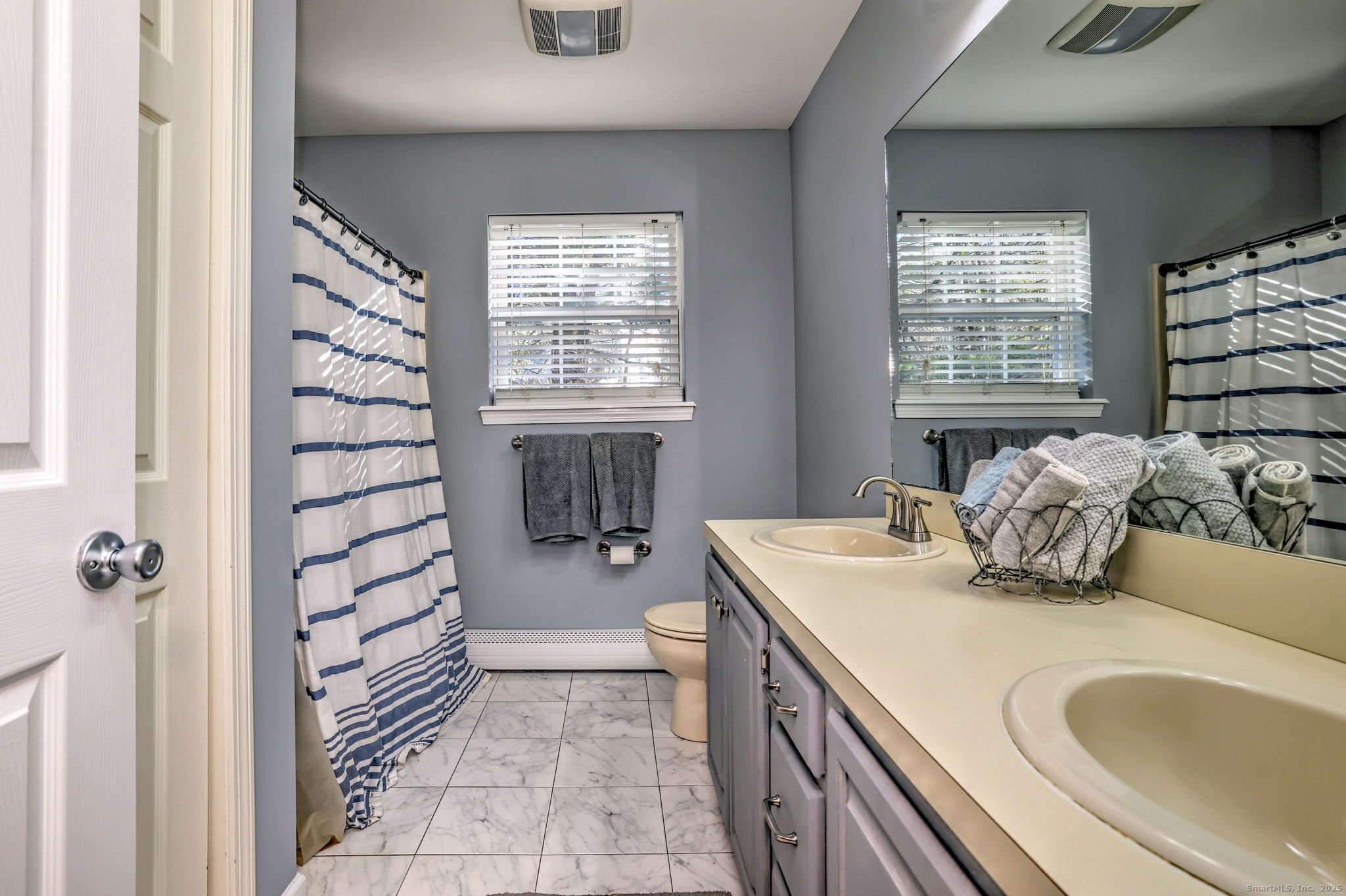 238 Turkey Roost Road Monroe, CT 06468 - Photo 26 of 34 a bathroom with a sink a toilet and shower