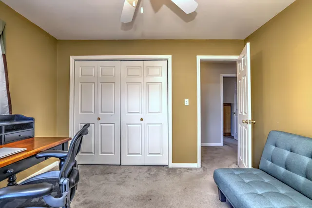 a view of a livingroom with furniture and windows