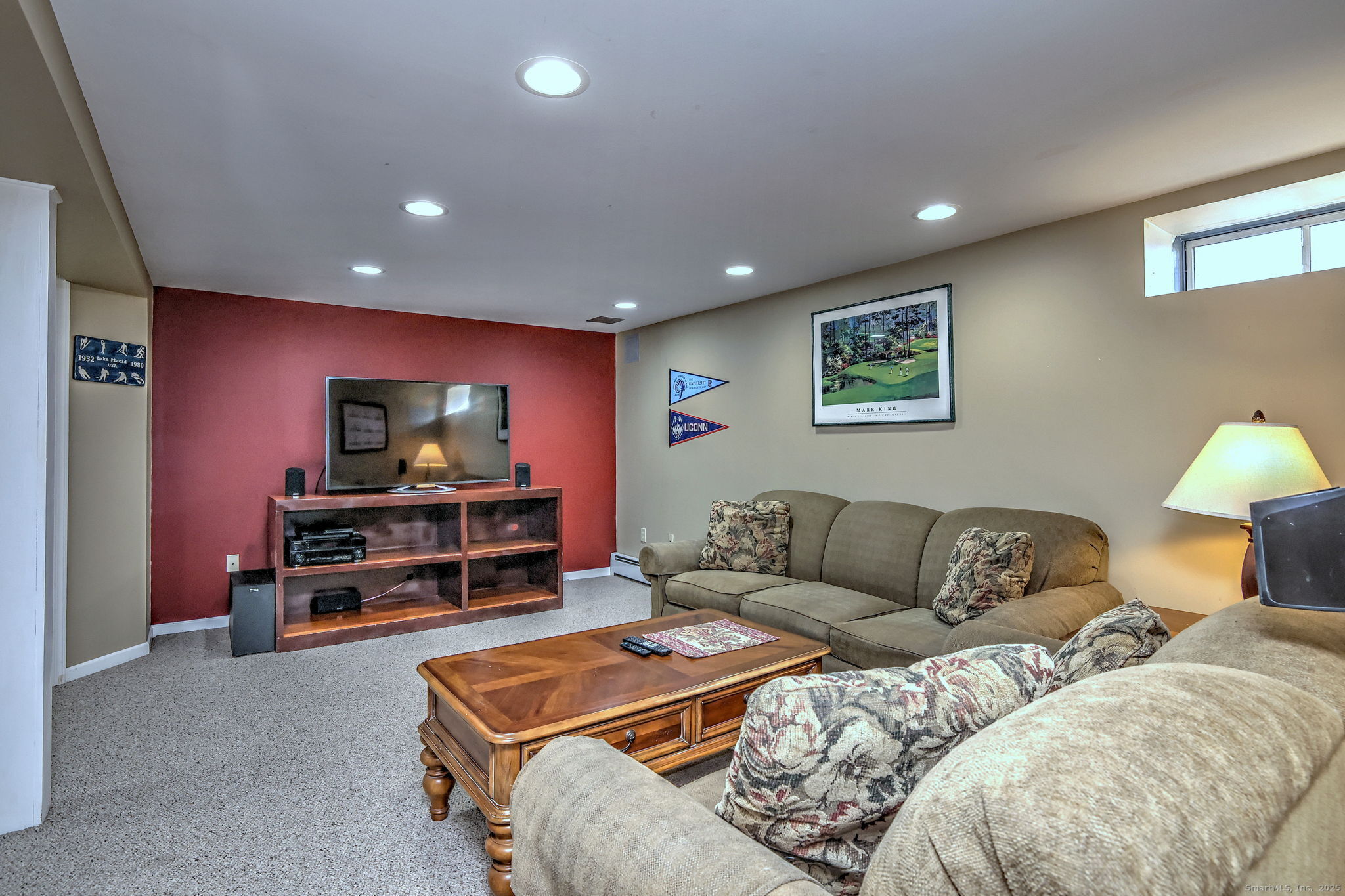 238 Turkey Roost Road Monroe, CT 06468 - Photo 29 of 34 a living room with furniture and a flat screen tv
