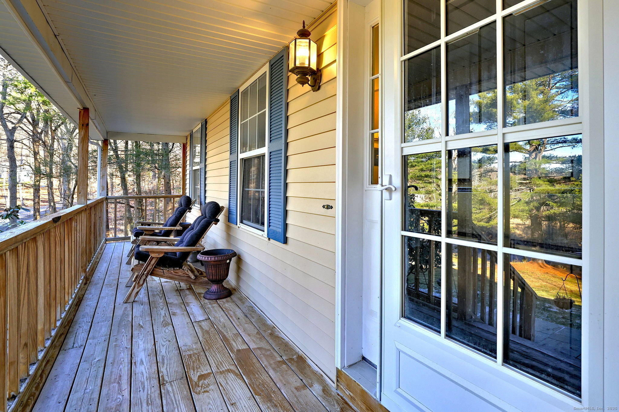 238 Turkey Roost Road Monroe, CT 06468 - Photo 6 of 34 a view of a balcony with chair and wooden floor
