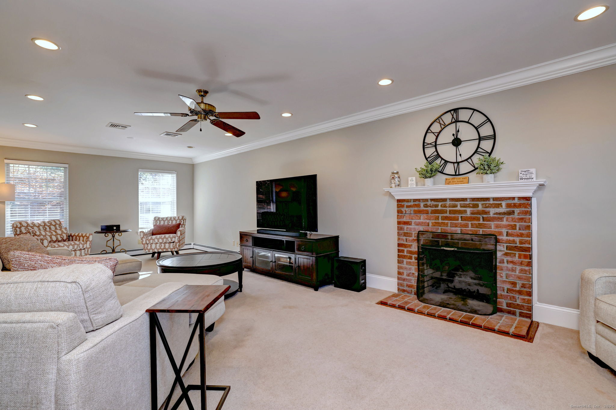 238 Turkey Roost Road Monroe, CT 06468 - Photo 7 of 34 a living room with furniture a fireplace and a flat screen tv