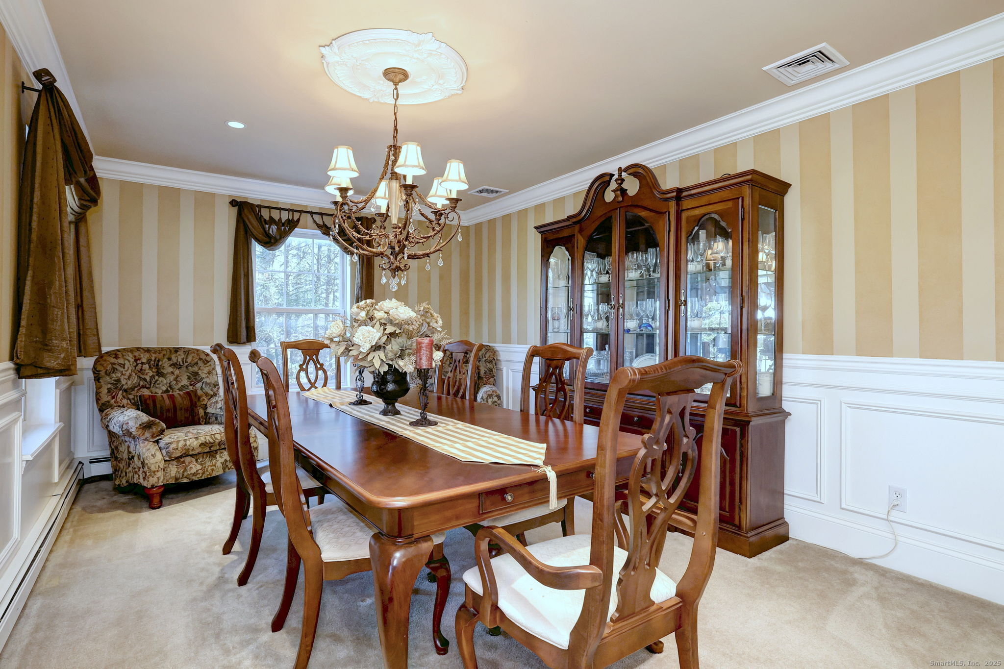 238 Turkey Roost Road Monroe, CT 06468 - Photo 10 of 34 a view of a dining room with furniture and a chandelier