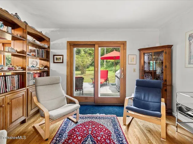a living room with furniture and a rug