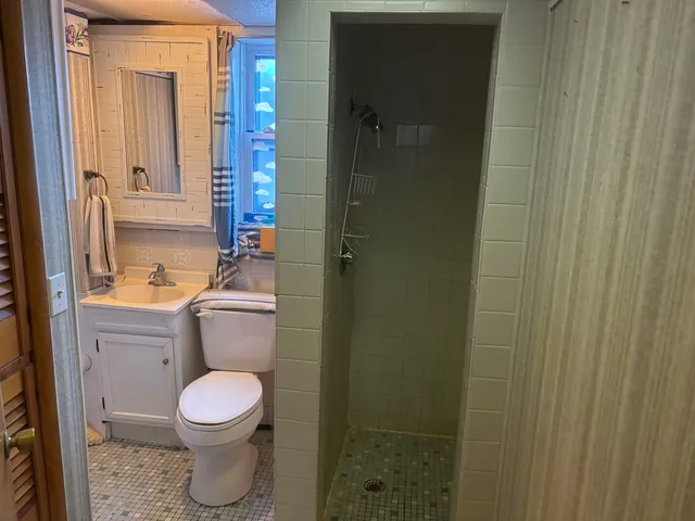 a utility room with cabinets washer and dryer