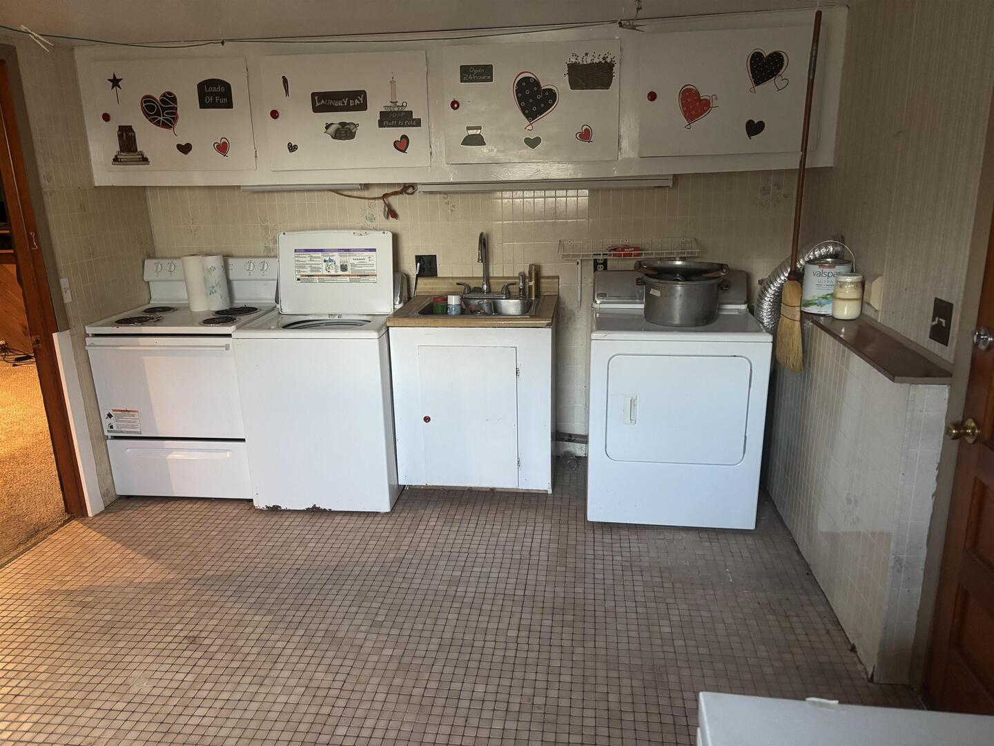 205 Jefferson Street Gorham, IL 62940 - Photo 14 of 17 a utility room with cabinets washer and dryer