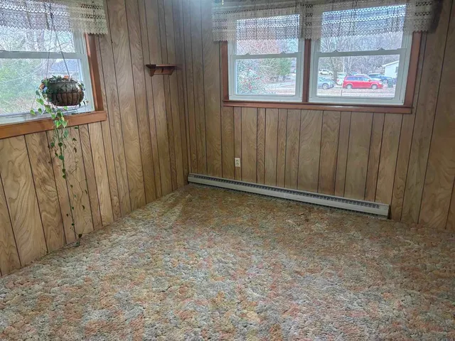 a view of a room with window and wooden floor
