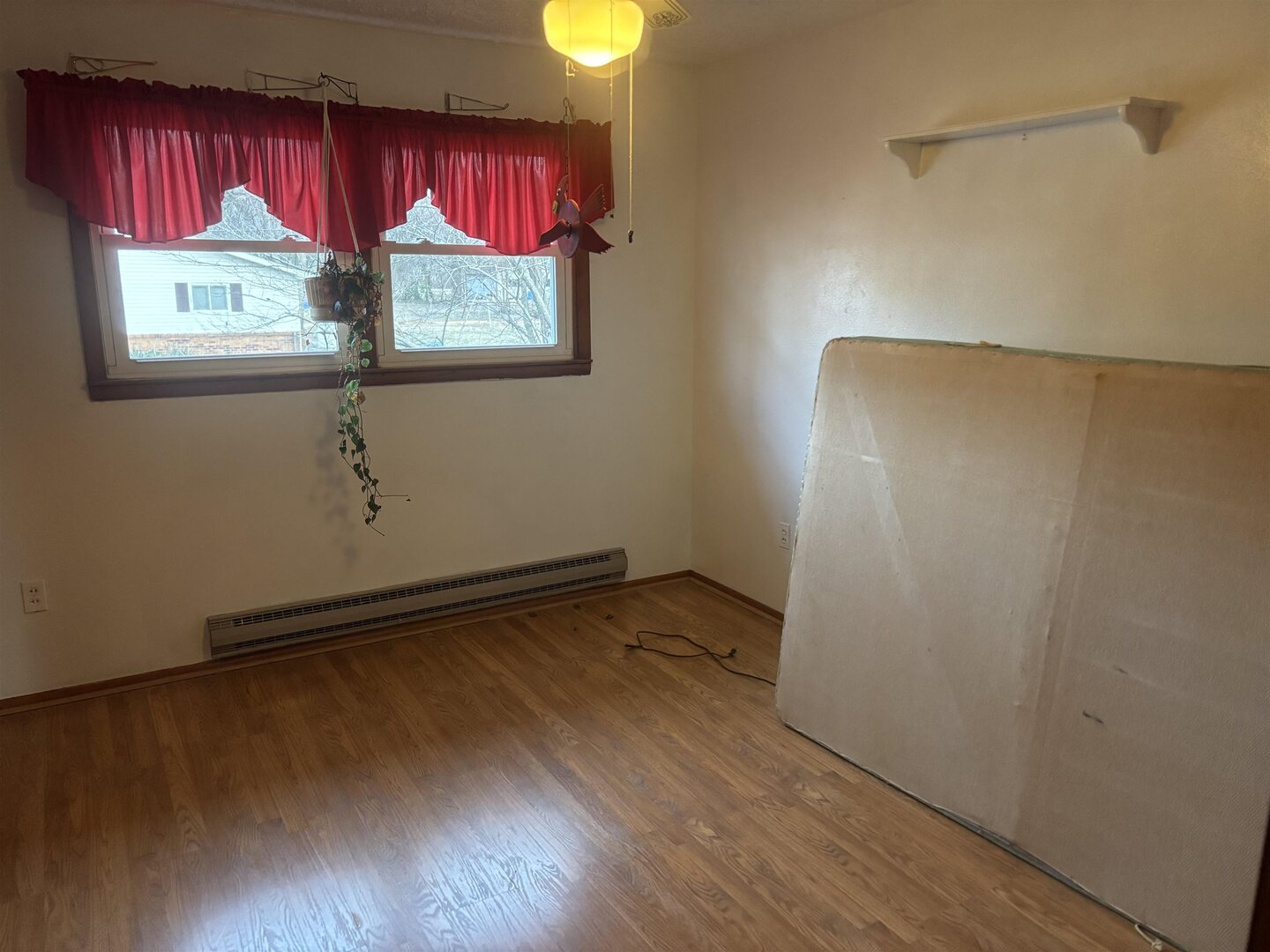 205 Jefferson Street Gorham, IL 62940 - Photo 9 of 17 a view of a room with window and wooden floor