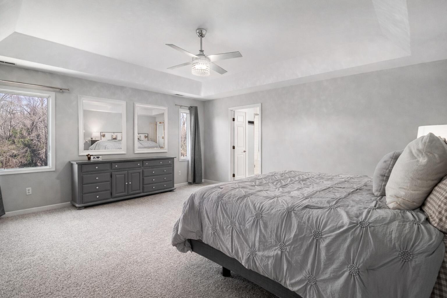10588 Erie Drive Crown Point, IN 46307 - Photo 19 of 45 a spacious bedroom with a bed dresser and a window