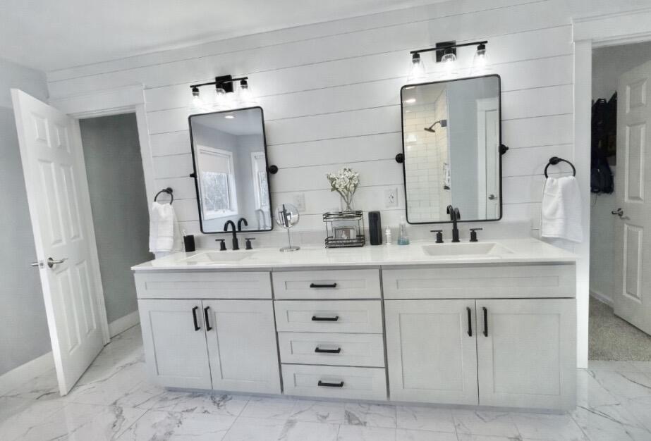 10588 Erie Drive Crown Point, IN 46307 - Photo 23 of 45 a bathroom with a double vanity sink double and mirror